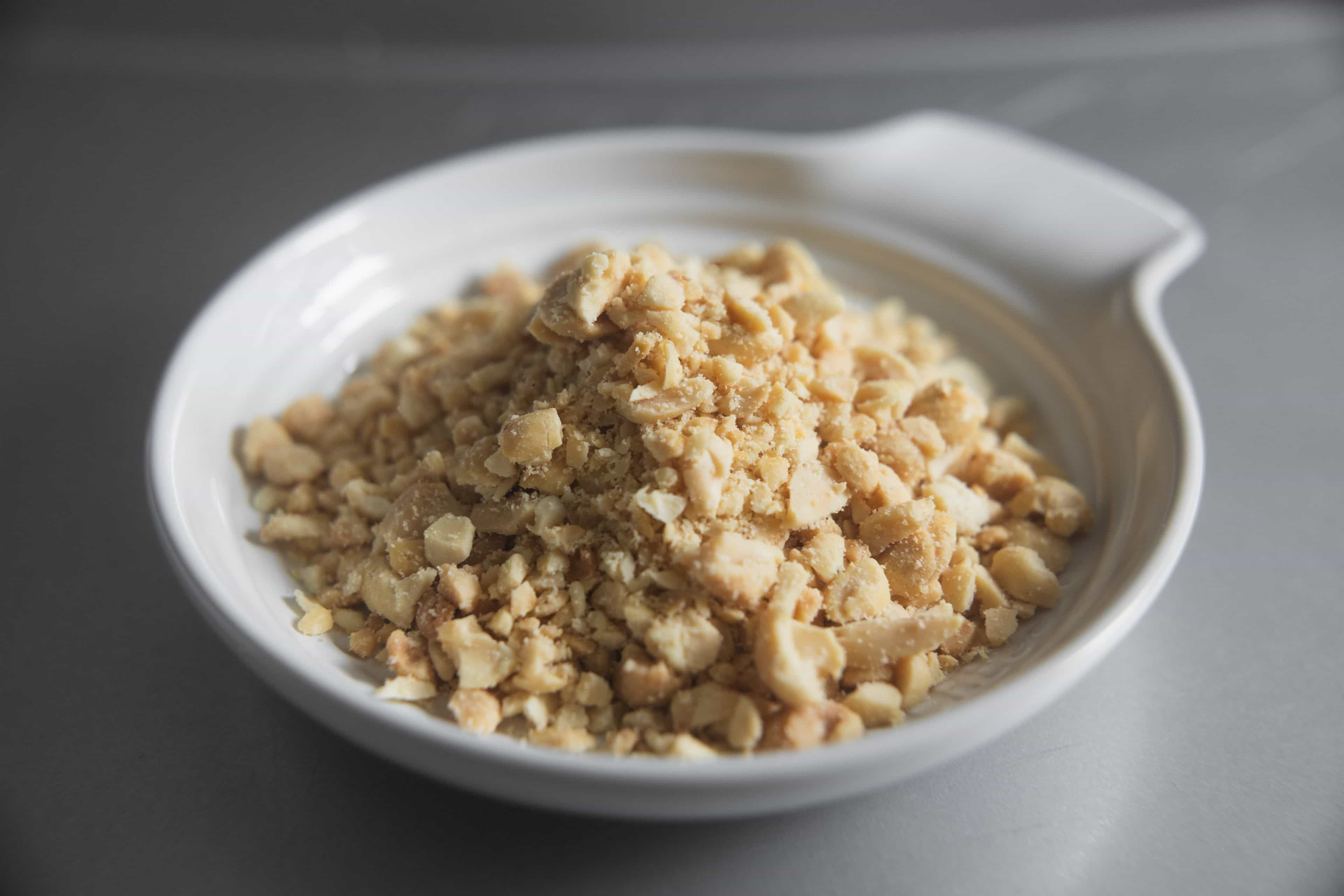 Small peanut chunks in small bowl.